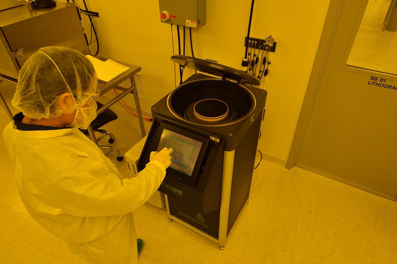 working on instrument in lab